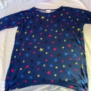 LuLaRoe woman’s Irma tunic blue background red yellow blue black stars size S